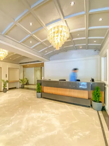 A wide shot of the Bhopal lobby in motion. The design ensures ample open space for guest flow while maintaining a sense of elegance with its high ceilings and refined material palette.