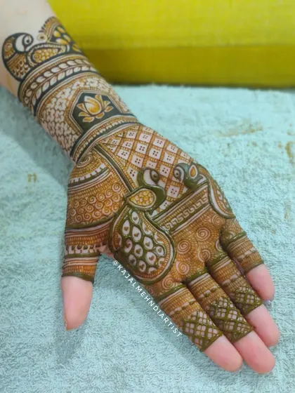 A beautiful peacock design for the palm, with a rich, dark stain that highlights the intricate details.