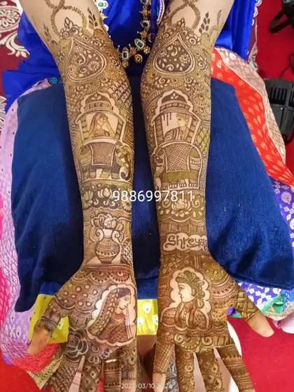 This theme-based mehendi tells a complete story, from the bride and groom portraits on the palms to the elephants carrying the wedding party on the forearms. I also included the bride's name, Shreya, for an extra personal touch.