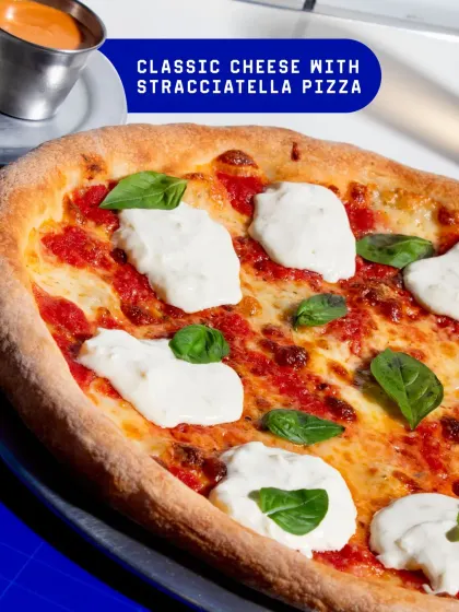 The Classic Cheese with Stracciatella. I elevate a simple margherita with dollops of creamy, fresh stracciatella cheese for a richer, more luxurious bite.