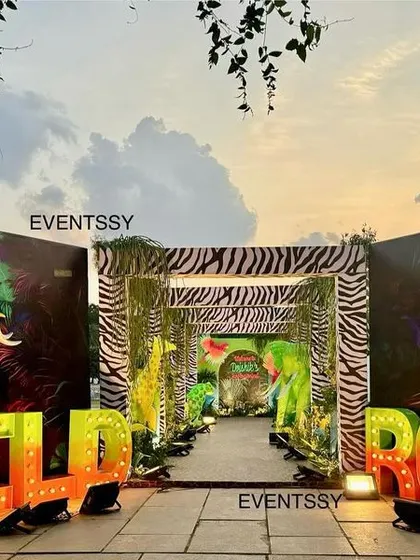 A dramatic 'Wild Roar' entrance with large marquee letters and glowing animal silhouettes, setting the stage for a neon jungle party.