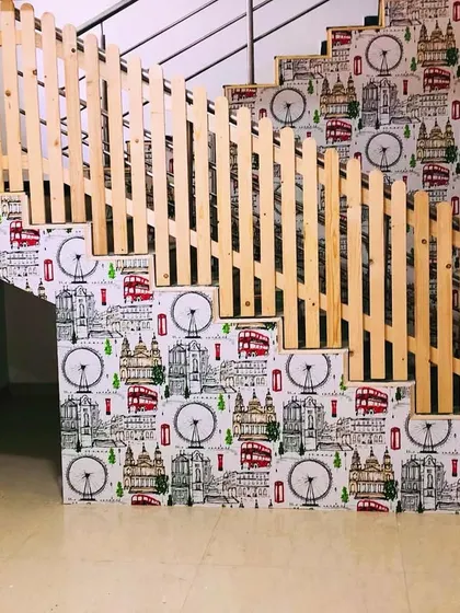 I can even transform staircases. For this project, I applied a quirky London-themed wallpaper to the stair risers, turning a functional part of the home into a unique design feature.
