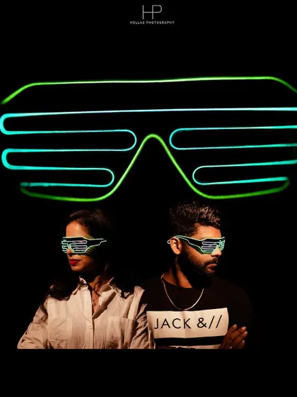 A cool and futuristic studio shot using neon LED glasses. This is a great example of how we can use unique props for a fun, edgy, and memorable pre-wedding photo.