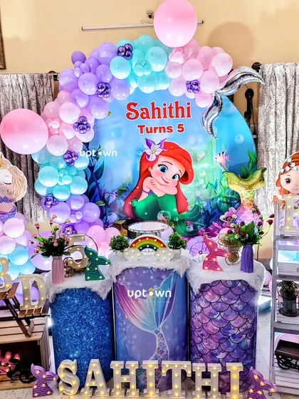 A mermaid-themed 5th birthday party for Sahithi, set up for a home celebration.