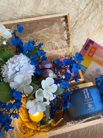 Another beautiful hamper from our collaboration with EKAM, this time with a striking blue theme. It features their Black Tea & Pomegranate candle and other curated items.