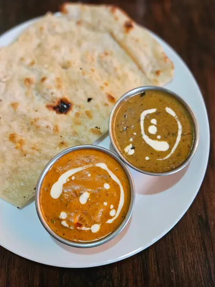 A collection showing the variety of our curries, from the preparation of Chicken Tikka Masala and smoky Kadai Paneer to finished bowls of Palak Paneer, Jeera Aloo, and Chicken Kadai. Each dish is prepared fresh and served hot.