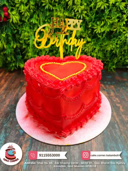 A beautiful red heart-shaped cake with intricate piping details. A classic and romantic choice for an anniversary or Valentine's Day.