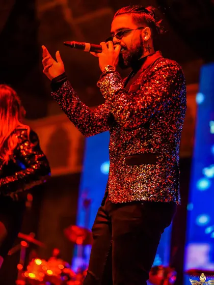 We don't just sing to the audience, we connect with them. This shot captures the passion and soul we put into every note.