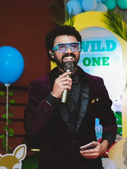 Hosting a birthday party with high energy and a big smile.