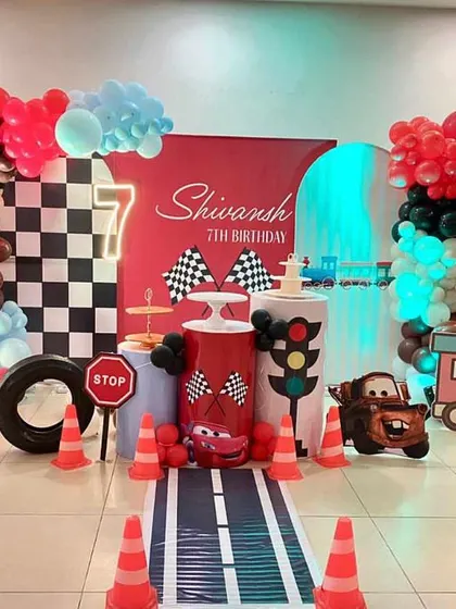 We pulled out all the stops for Shivansh's 7th birthday with a Disney Cars theme. The setup included a custom road runner, traffic signs, character cutouts of Mater, and a vibrant balloon display.