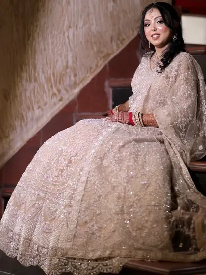 Another beautiful shot of the bride on the stairs, capturing her grace and the beauty of her outfit.