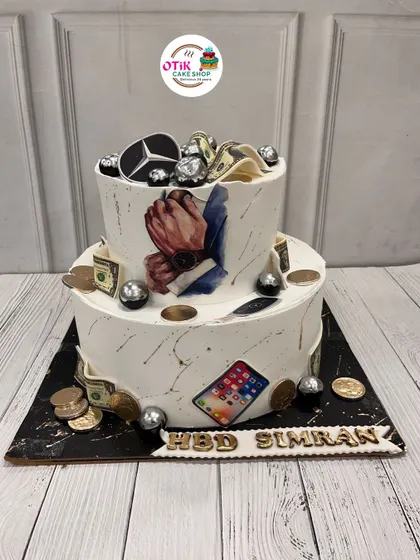 This cake is all about celebrating someone's favorite things. We incorporated edible prints of a luxury car, an iPhone, and money for a truly personalized birthday cake.