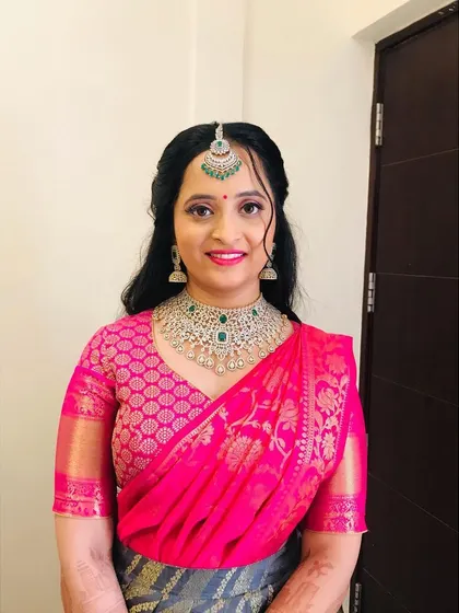 A smiling portrait of the bride. The natural-looking makeup ensures she looks like herself, just more radiant.