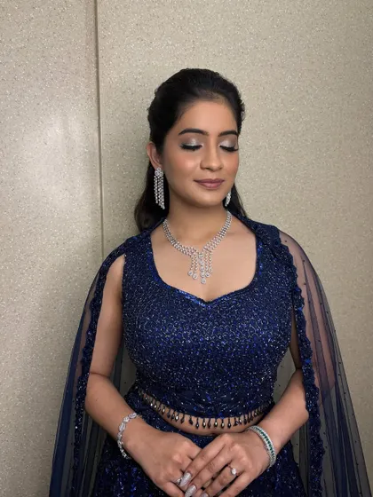 A close-up of the shimmering metallic eyeshadow. For this Sangeet look, I used a beautiful silver-blue shimmer on the lids to match her royal blue outfit.