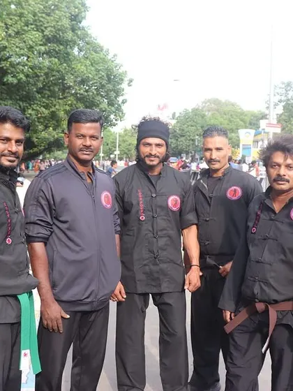 A photo of me with some of our senior instructors at a public event. This team is the backbone of the academy, each one a skilled and dedicated teacher.