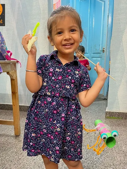 A happy moment in the studio. This little one is enjoying a snack break after finishing her fun craft projects.