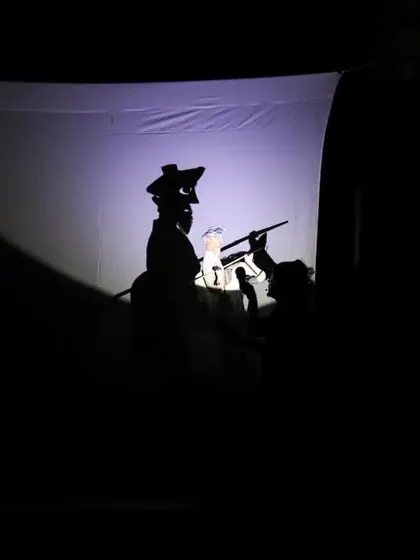 The art of shadow puppetry creates a dramatic silhouette during the performance of 'Mamulengo de la Mancha' from Brazil. Our festival programming explores a wide variety of puppetry styles, from ancient forms to modern innovations.
