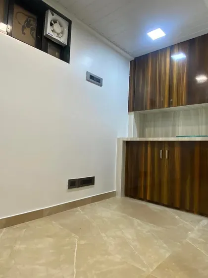 This image shows the custom cabinetry and storage unit I built for the office. The dual-tone wood laminate finish adds warmth to the space, providing essential storage without compromising on design. Every piece of furniture is built to fit the specific layout and needs of the client.