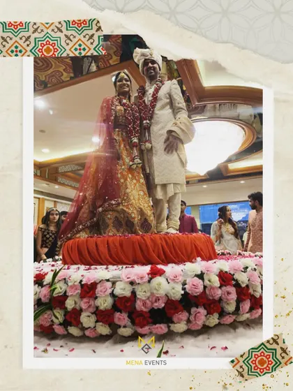 A couple enjoying their moment on the 360-degree rotating floral stage. It’s a beautiful and practical solution for large venues.