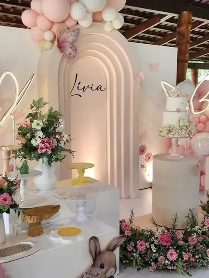 A wide shot of an outdoor butterfly-themed party, showcasing how I adapt my designs for different venues. The open-air setting complements the natural, airy feel of the theme.