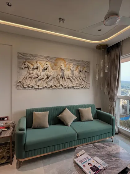 A different take on the 7 horses theme, this monochrome relief sculpture is perfect for a sophisticated living room. The neutral stone finish complements the modern decor and green sofa.