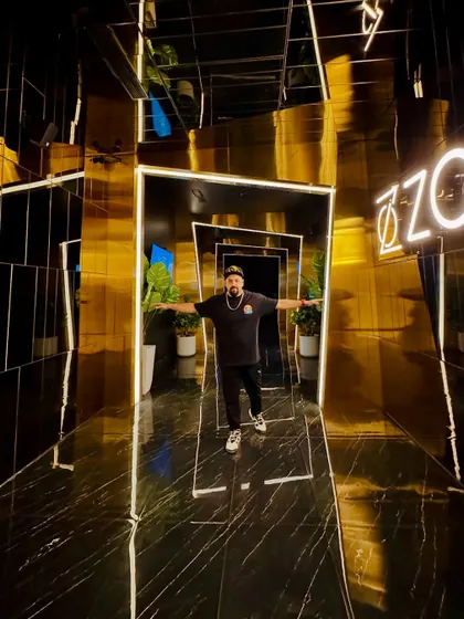 Trusting the grind and riding the wave. A moment of confidence in a cool, reflective hallway.