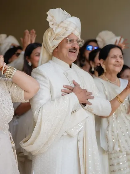 The proud and happy expressions of the bride's parents during the first look. These family moments are priceless.