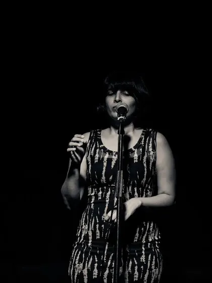 A black and white portrait from a live show. This captures the quiet focus and connection I feel with the music when I am on stage.