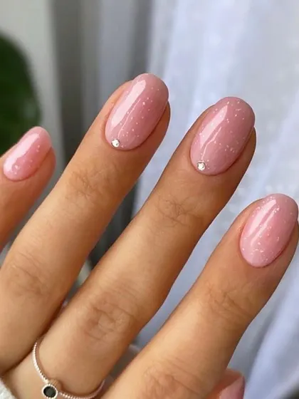 A simple yet elegant design using a semi-transparent glitter gel polish. This technique is perfect for clients who want a subtle sparkle, and you'll learn how to apply it for a flawless, even finish.