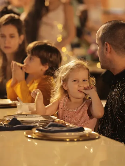 A candid moment of a child enjoying her food. We believe that great hospitality means making guests of all ages feel welcome and cared for.