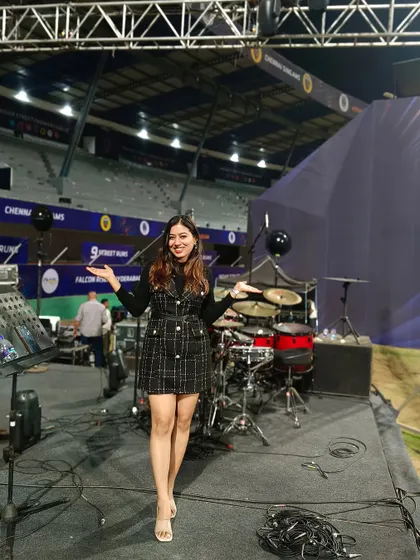 On the big stage at the stadium, with my arms wide open, ready to welcome the audience's energy.