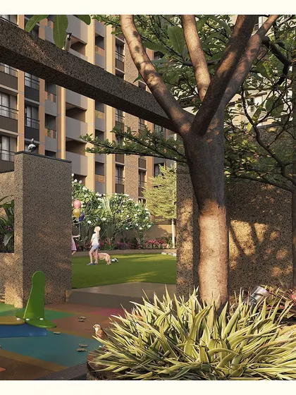 The transition from the active play area to the quiet green lawn is buffered by planting, creating a natural and safe boundary.
