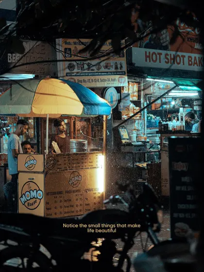A street-side momo stall in Delhi, glowing in the night. These small pockets of light and activity are what make exploring a city after dark so rewarding.