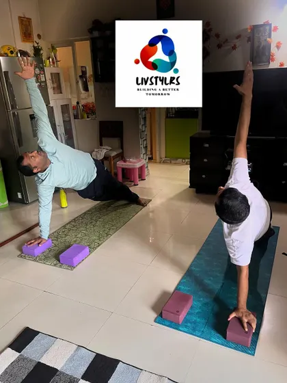 Two clients hold a strong side plank, demonstrating excellent core and shoulder stability.