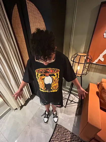 A top-down shot showing off the fit. Style is a big part of hip-hop culture.