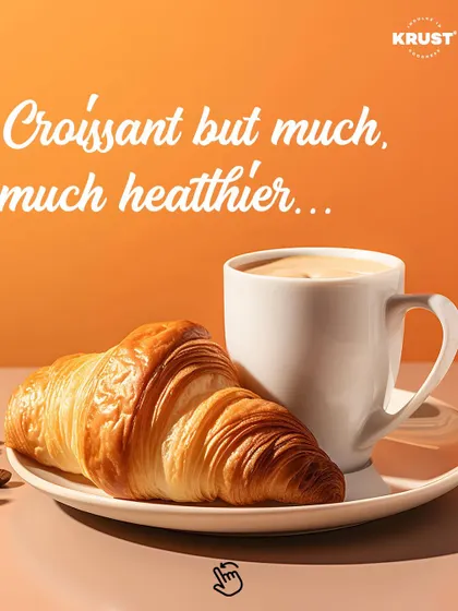 A classic, buttery croissant paired with a perfectly brewed coffee. This image captures the essence of a perfect morning break at my café, highlighting our commitment to authentic French viennoiserie.