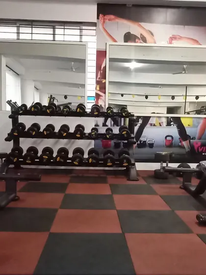Our weight training area is organized and clean, with mirrors to help you check your form as you lift.