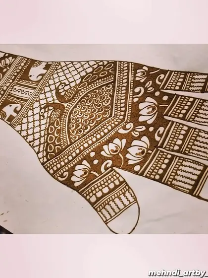 Here is another design concept on paper. This sketch helps me visualize the flow of the pattern across the hand, ensuring the peacocks, florals, and geometric fills work together harmoniously.