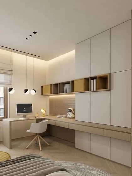 An L-shaped study table integrated with a full-wall wardrobe. This design maximizes storage and provides a spacious work area, ideal for a bedroom or home office.