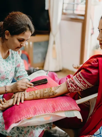 A focused moment during a bridal mehendi session. Creating detailed and personalized stories for my brides is a responsibility I cherish.