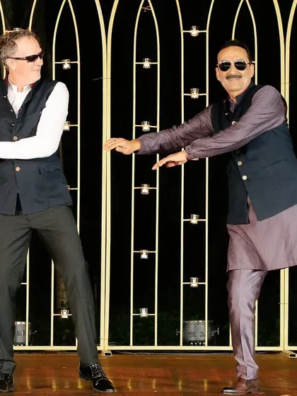 The fathers of the bride and groom showing off their moves together. We love bringing both families together on the dance floor.