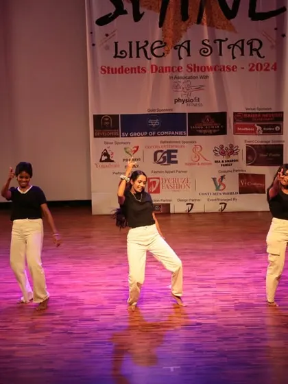A small group of dancers enjoying their moment on stage during the showcase.
