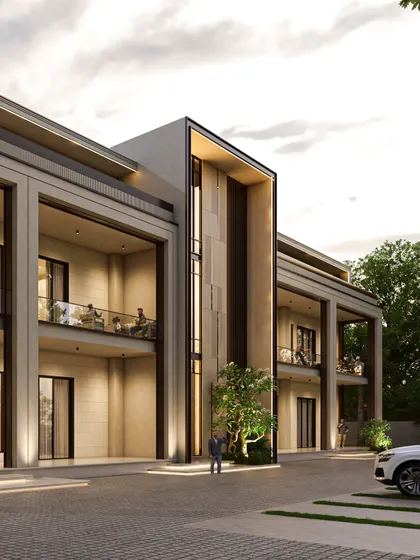 The central mass of the farmhouse facade features a double-height vertical slit, hinting at the spiral staircase within. This element creates a strong focal point and adds a sense of grandeur to the entrance area.