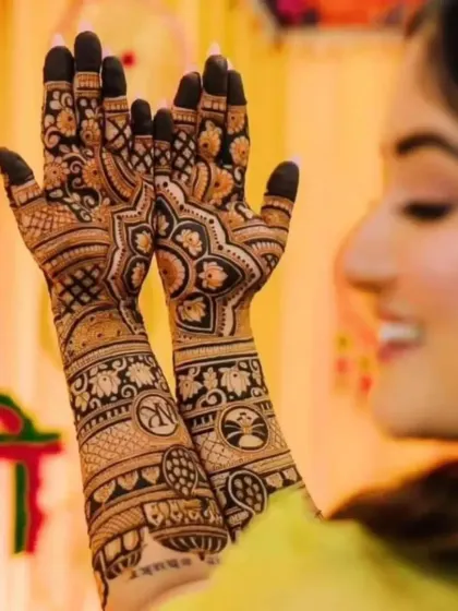 A modern take on bridal mehandi, with personalized initials and symbols woven into a design of mandalas and floral patterns.