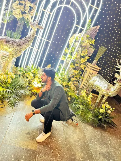 Posing with the elaborate decor at a wedding event. The ambiance and setup are a huge part of the overall experience.