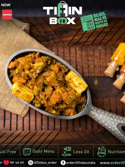 This Kadai Paneer, cooked with bell peppers and aromatic spices, is a true delight. The large scoop shows the rich texture and generous chunks of paneer.