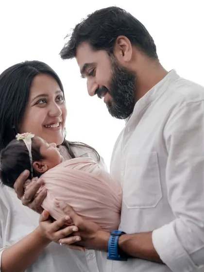 A bright and happy family portrait. Using a clean white background, I can create timeless images that highlight the joy and love of your new family.