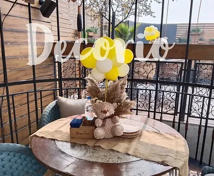 Here is a closer look at a table centerpiece I created for a baby shower. The simple balloon bouquet and small teddy bear add a festive touch to the guest tables without being overwhelming.