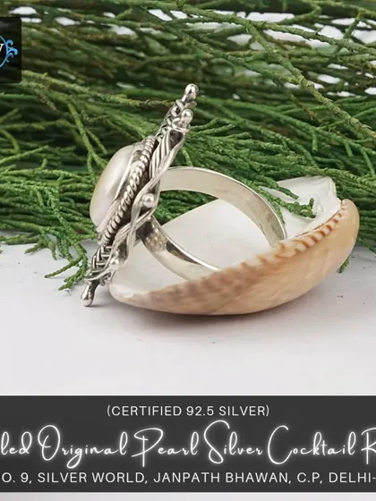 A side view of the coiled pearl cocktail ring, showing its impressive height and three-dimensional structure.