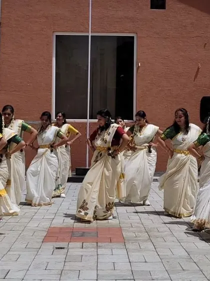 The ladies moving gracefully during our Onam celebration performance. Every movement was carefully choreographed to reflect the elegance of the occasion.